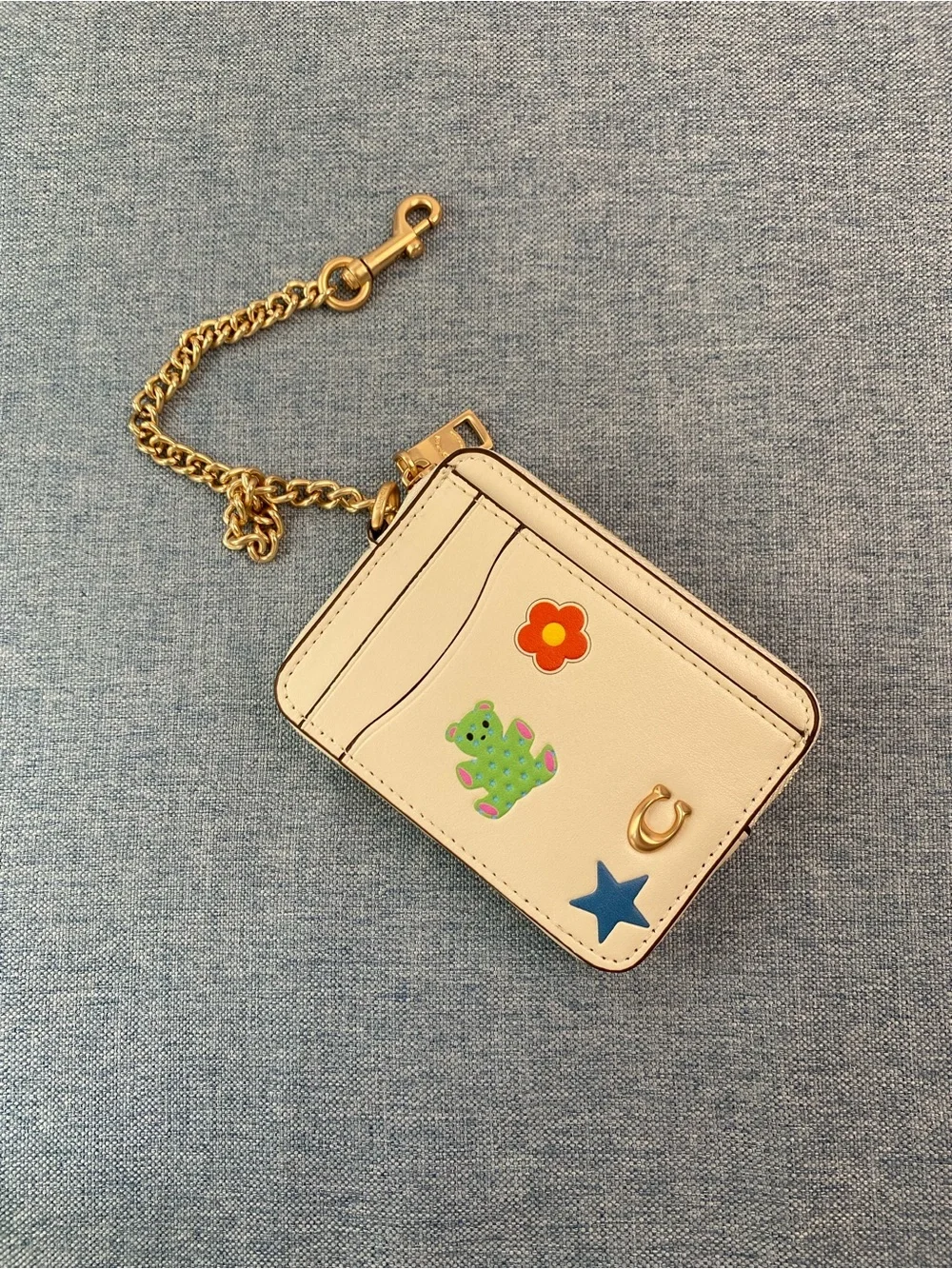 Coach Cream Card Holder with Gold Chain and Playful Charms